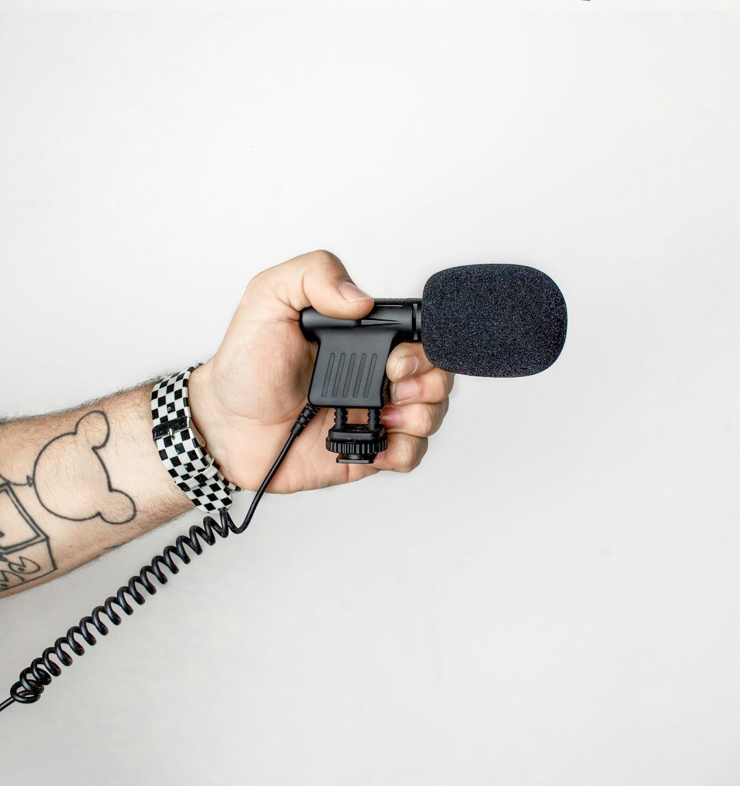 Reporter doing live broadcast outdoors with microphone