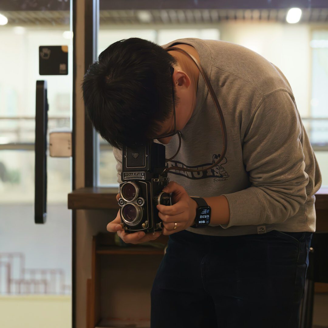 Person presenting in front of professional video camera during training