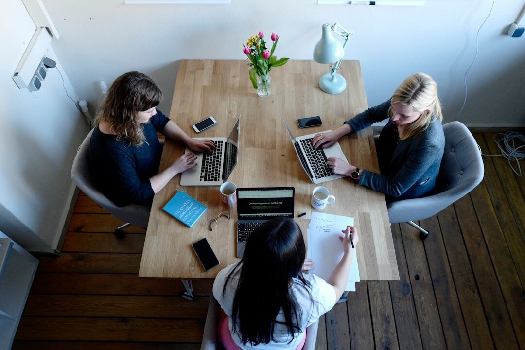 Team of media professionals collaborating at a meeting table