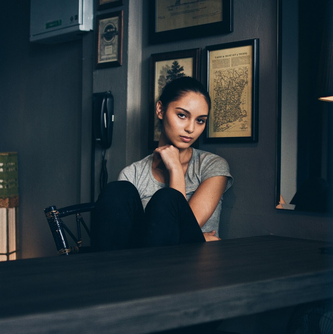 Journalist sitting at desk writing narrative story notes